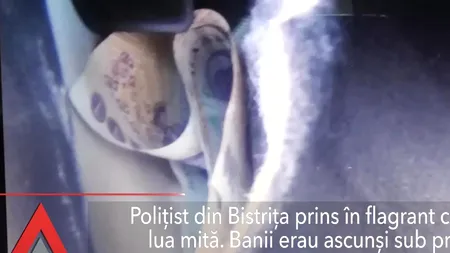 Mita, bat-o vina: Polițist din Bistrița prins în flagrant când lua mită / Locul unde își ascundea banii, chiar în văzul tuturor