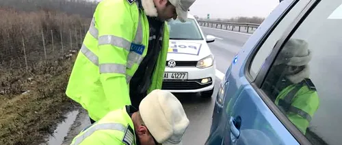 Cum arată tânăra pe care acești doi polițiști au ajutat-o să schimbe o roată la mașină pe A1. GALERIE FOTO