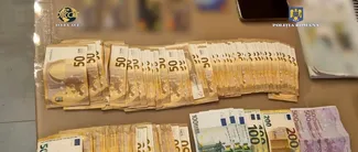 VIDEO | Grup infracțional din Dâmbovița, specializat in cămătărie și proxenetism, destructurat de DIICOT