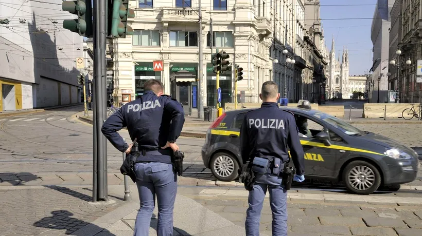 SCANDAL în fața unui bar din Milano, provocat de o româncă de 33 de ani. A mușcat un agent de securitate și a amenințat cu moartea mai mulți polițiști