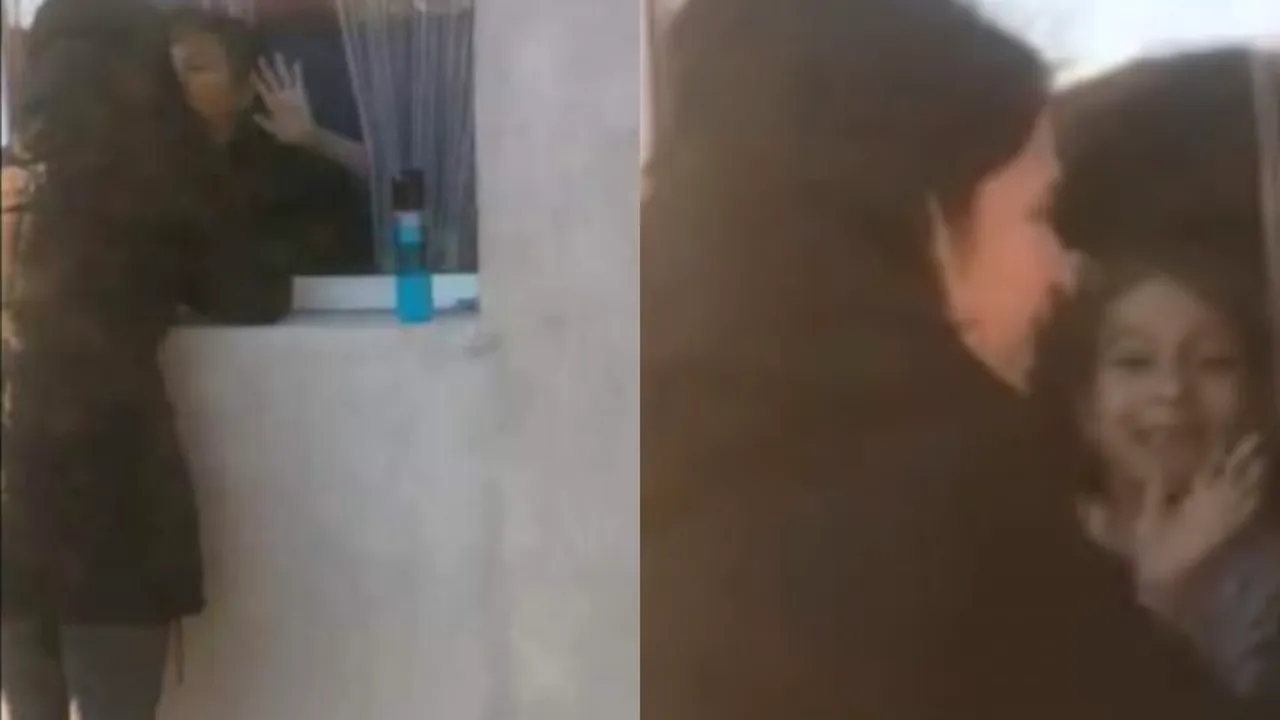 VIDEO EMOȚIONANT | Două cadre medicale își văd copiii doar de la fereastră | VIDEO