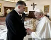 Ilie Bolojan și Marcel Ciolacu merg sâmbătă la funeraliile Papei Francisc. Ce i-a cerut Suveranul Pontif premierului în 2024?