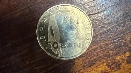 Mai știi celebra monedă de 50 de bani de la Revoluția din 1989?! Suma uriașă cu care se vinde acum, în 2023