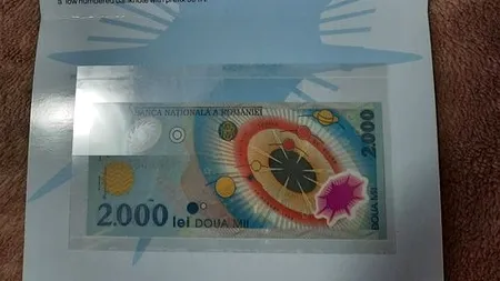Cât a ajuns să coste pe OLX o bancnotă de 2000 de lei cu eclipsa din 1999