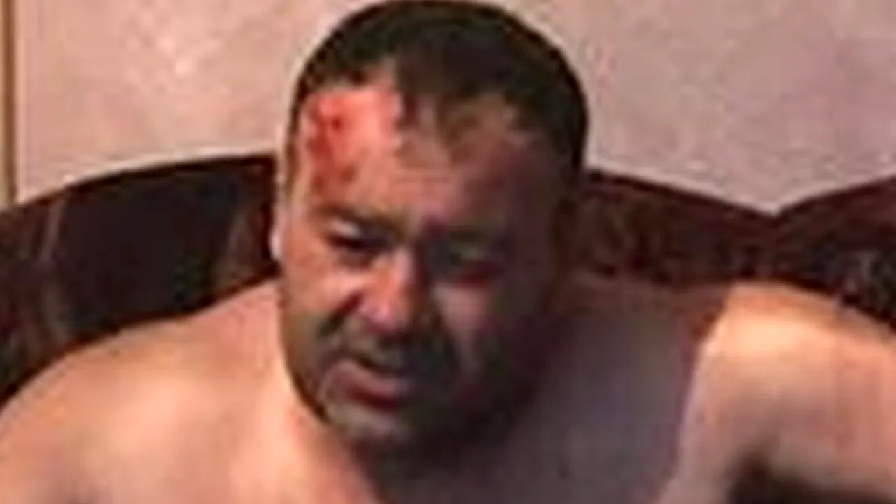 Bărbatul acuzat că a împușcat mortal un polițist, externat din spital și dus la penitenciar
