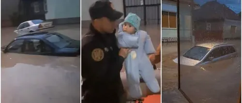 IMAGINI EMOȚIONANTE. Un bebeluș de doar 9 luni a fost evacuat pe geam la Aiud după ce apele au invadat strada! - VIDEO