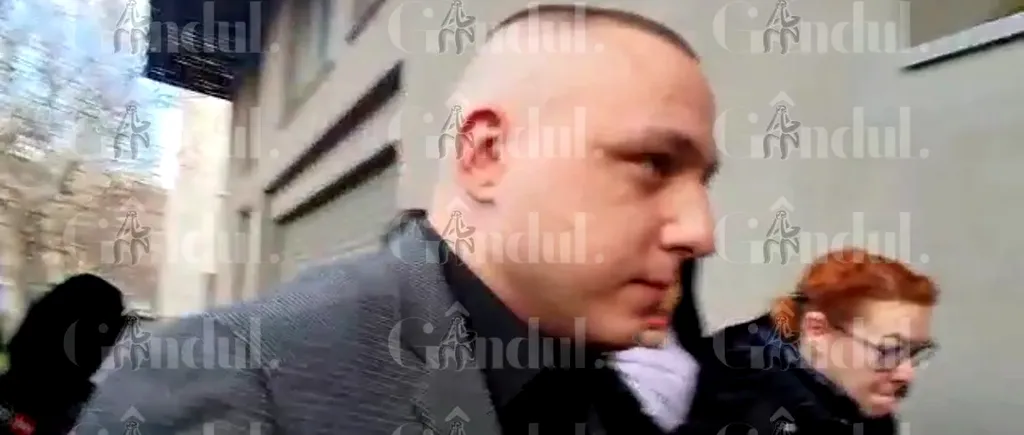 Vlad Obu a fost ridicat de DIICOT după ce ar fi exploatat sexual șapte tinere. Prietenul fraților Tate obliga fetele să-și tatueze chipul său