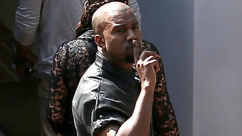 Kanye West a agresat un fotograf după ce s-a lovit cu capul de un semn de circulație