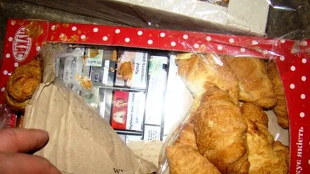 Percheziții la o grupare specializată în contrabandă cu țigări. 80 de persoane vor fi audiate