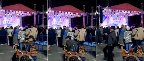 Un bărbat aflat în scaun cu rotile, filmat în timp ce se ridică şi începe să danseze, la Zilele Oraşului Deva
