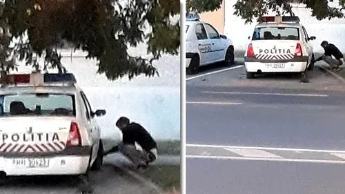 Un tânăr a fost fotografiat cum dezumflă roțile unei mașini de Poliție chiar în parcarea unei secții. Autorul nu a fost prins - FOTO