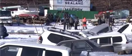 Imagine de coșmar pentru mulți șoferi. Zeci de mașini scufundate, după ce au fost parcate pe un lac înghețat - VIDEO