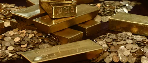 Aurul se apropie de 1.800 dolari, iar deținerile investitorilor de pe burse au atins un NOU RECORD