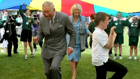 FOTOGRAFIILE SĂPTĂMÂNII: Barack Obama ud până la piele, Prințul Charles într-o ipostază surprinzătoare
