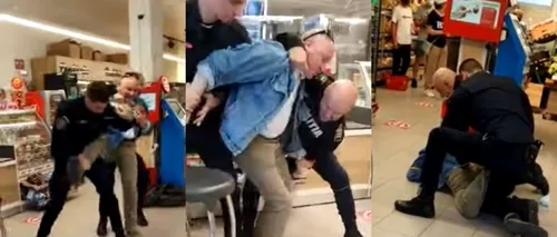 Bărbat înarmat cu un cuțit, pus la pământ de polițiști într-un supermarket din Sibiu - VIDEO