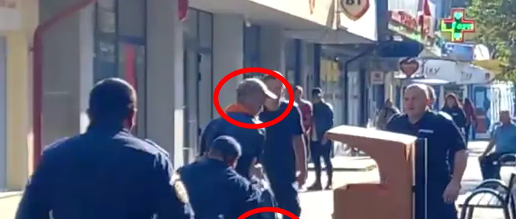 VIDEO - Panică pe o stradă din Focșani: Un bărbat a amenințat trecătorii cu un satâr / Momentul în care jandarmii l-au pus la pământ