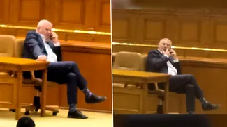 Răsturnat pe scaunul chestorilor, deputatul liberal Gigel Ştirbu a vorbit la telefon pe scena plenului şi şi-a expus şosetele vărgate