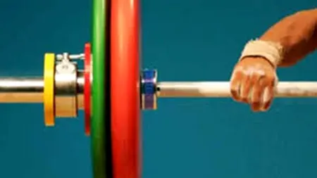 Trei sportivi români, halterofili de nivel înalt, descalificați din cauza dopajului. România a pierdut medaliile de argint şi bronz și  se confruntă acum cu sanctiuni