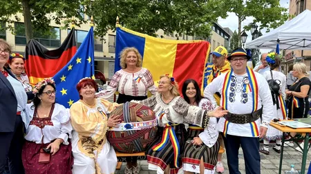 Românii au scris istorie în Germania. Două recorduri mondiale: BRÂU românesc de 1.667,41 m, cu o greutate de 70 kg - FOTO
