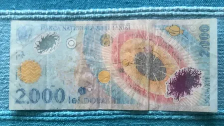 Mai ții minte celebra bancnotă de 2.000 de lei de la eclipsa din 1999? Se vinde acum cu 25.000 de euro