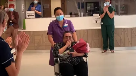 Imagini emoționante după lupta cu noul COVID-19: O asistentă medicală a fost externată în aplauzele colegilor după ce fusese în comă 40 de zile - VIDEO