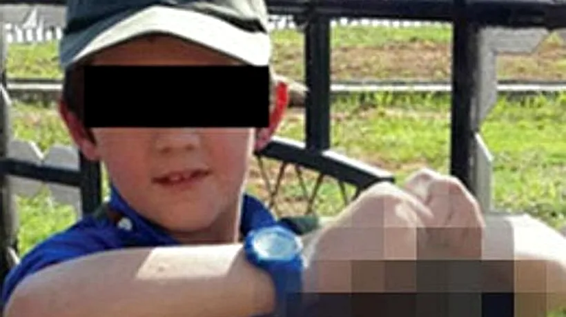 Un australian a postat pe Twitter o poză cu fiul său minor arătând capul unui militar sirian
