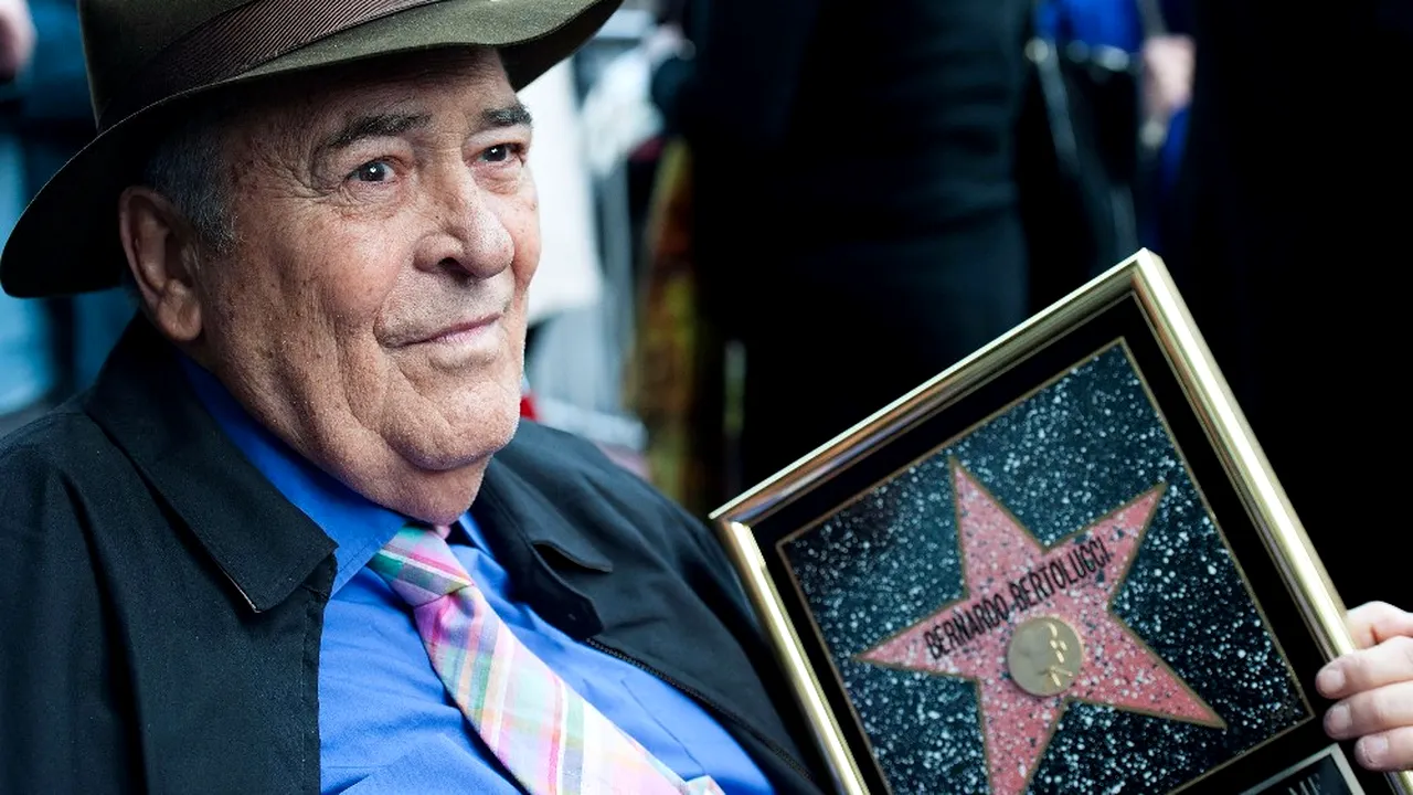 A murit BERNARDO BERTOLUCCI. Regizorul italian avea 77 de ani