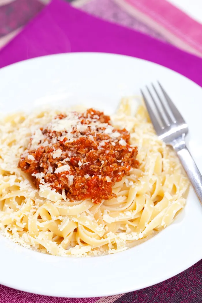 Plate of spaghetti bolognese,Image: 295950853, License: Royalty-free, Restrictions: Specifically, you may not use the Images in ways or contexts that might reasonably be construed as pornographic, defamatory, libellous or otherwise unlawful; Specifically, you may not use images depicting any model in any unduly controversial or unflattering context, unless accompanied with a statement indicating that the person is a model and the images are being used for illustrative purposes only., Model Release: no