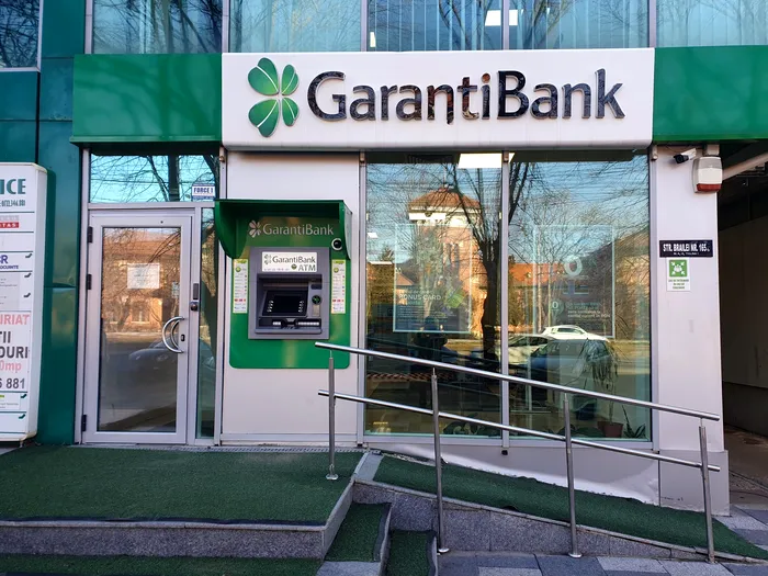 Raiffeisen va prelua Garanti Bank România. Când va fi finalizată achiziția și când începe fuziunea operațională