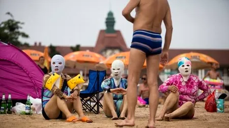 IMAGINEA ZILEI. Cum se protejează chinezii de soare  