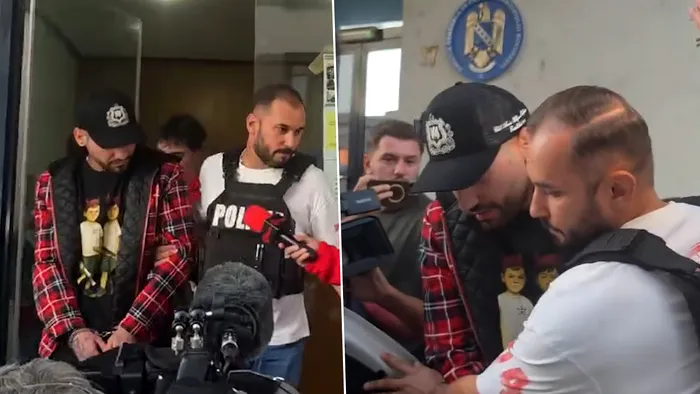 Primele imagini cu trapperul Ian cu momentul reținerii. Încătușat, artistul a fost surprins în timp ce este condus la mașina poliției