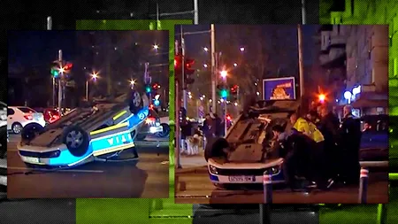 VIDEO | Un polițist aflat în misiune a izbit un taxi, într-o intersecție din București. În urma impactului, mașina agentului s-a răsturnat