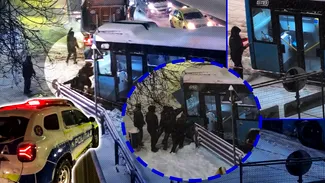 Imagini cu un autobuz STB ajuns într-un gard din cauza zăpezii. Câţiva oameni încearcă să-l împingă cu mâinile