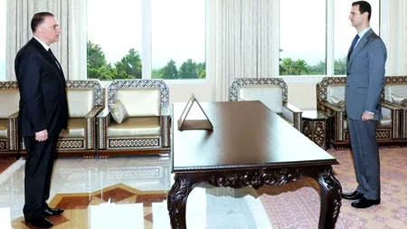 Ce este în neregulă cu această fotografie a președintelui Siriei