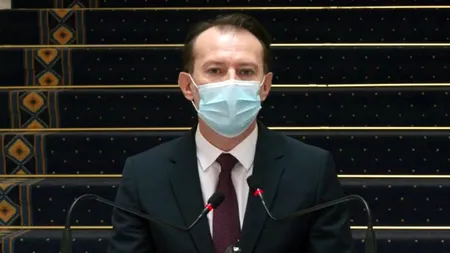 Florin Cîțu, tricou cu trupă rock în ziua vaccinării! Ce trupă ascultă premierul (FOTO)