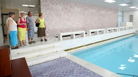 Guvernul introduce impozitul pe piscine și parcări