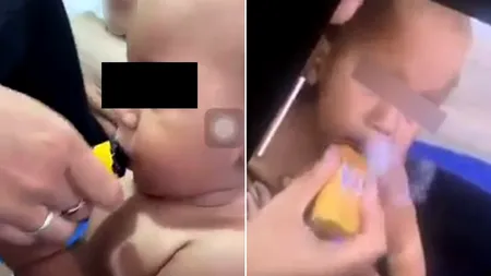 Imagini dezgustătoare! Bebeluș de 11 luni, filmat în timp ce era pus să „fumeze” o ȚIGARĂ electronică: ”Maturizează-te și fii o mamă mai bună”