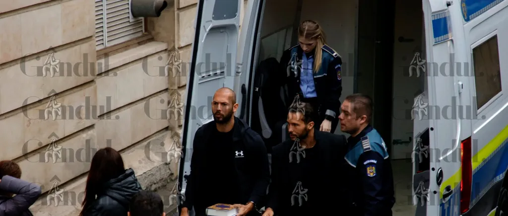 VIDEO EXCLUSIV | Primele imagini cu frații Tate înainte de a intra în sala de judecată de la Curtea de Apel București / Cartea cu care Andrew Tate a coborât din duba poliției și pe care o va ține în mână în fața instanței