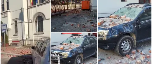 VIDEO | Bucăți de tencuială au căzut peste mașini la Târgu Jiu. Clădirea Primăriei a fost evacuată