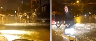 Imagini ȘOCANTE în Capitală! Un bărbat cu un târnăcop în mână încearcă să oprească un șofer care trece cu viteză printr-o zonă inundată