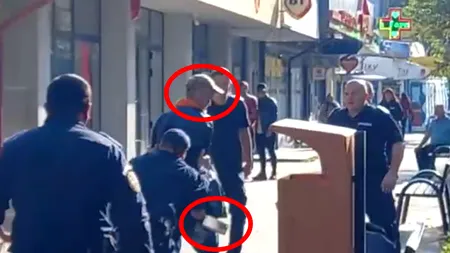 VIDEO - Panică pe o stradă din Focșani: Un bărbat a amenințat trecătorii cu un satâr / Momentul în care jandarmii l-au pus la pământ