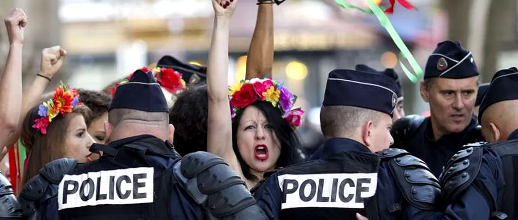 Cum a ajuns un polițist la picioarele unei activiste Femen 