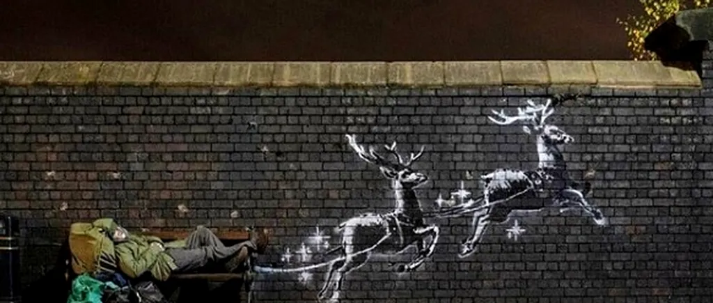 Celebrul artist în graffiti, Bansky, surprinde din nou cu o creație care emoționează până la lacrimi: Statutul oamenilor fără adăpost de Sărbători - VIDEO 