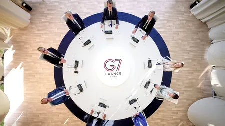 Febra Cupei Mondiale ajunge la summit-ul G7 de la Evian. Merz i-a făcut o surpriză „întârziată“ lui Trump de ziua lui. Ce cadou i-a oferit cancelarul german