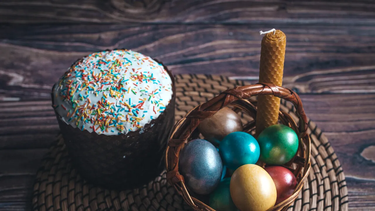 Still life Easter eggs and Easter cake on the table. The concept of home comfort in the bright holiday of Easter. 